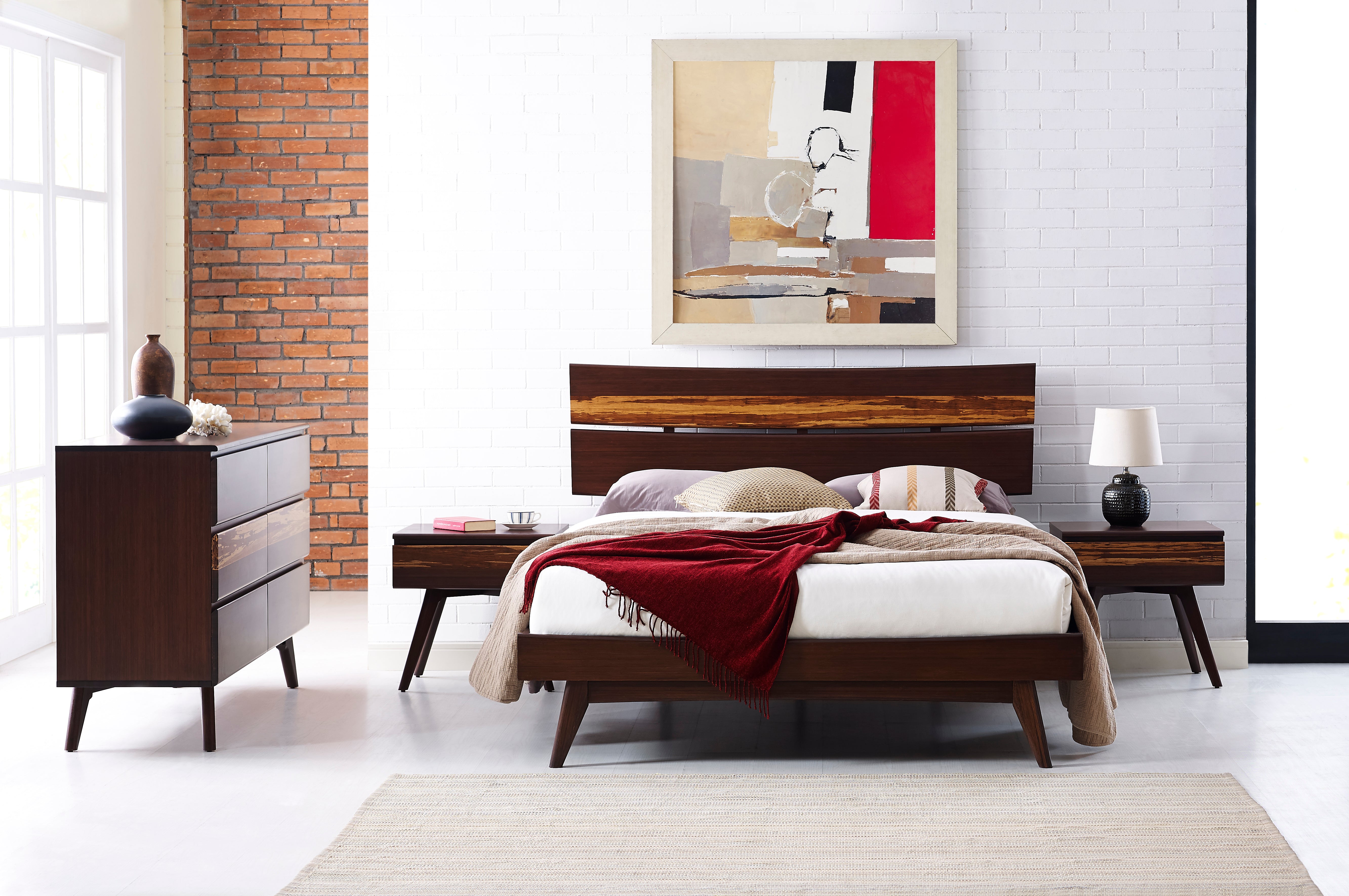 A renewable Azara Bamboo Bedframe by Greenington in sable color, placed in a bedroom with a three-layer dresser with six drawers next to it.