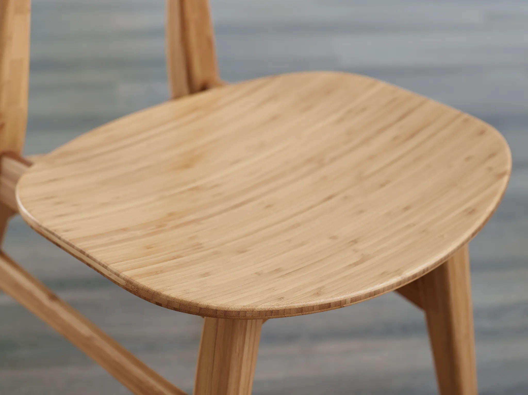 A renewable Cassia Bamboo Dining Chair by Greenington in wheat color, detailed view of the seat surface.