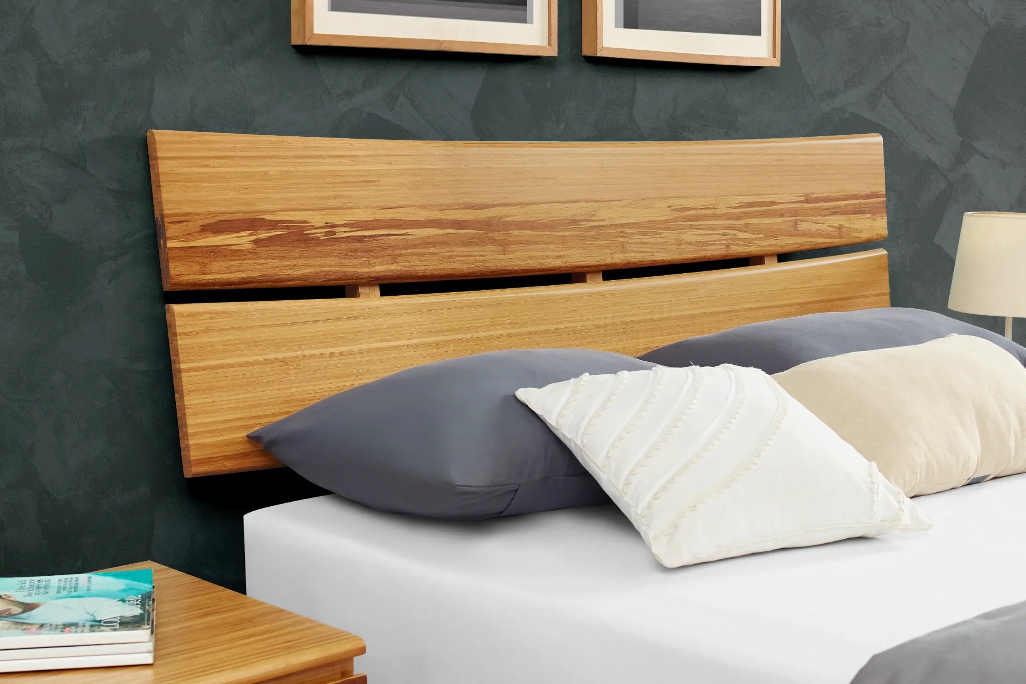 A close-up view of the headboard of the renewable Azara Bamboo Bedframe by Greenington, in caramel color.